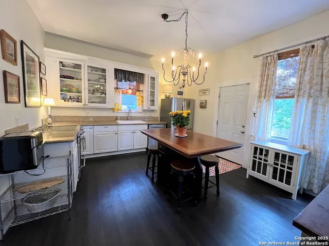 a view of a dining room with furniture and window