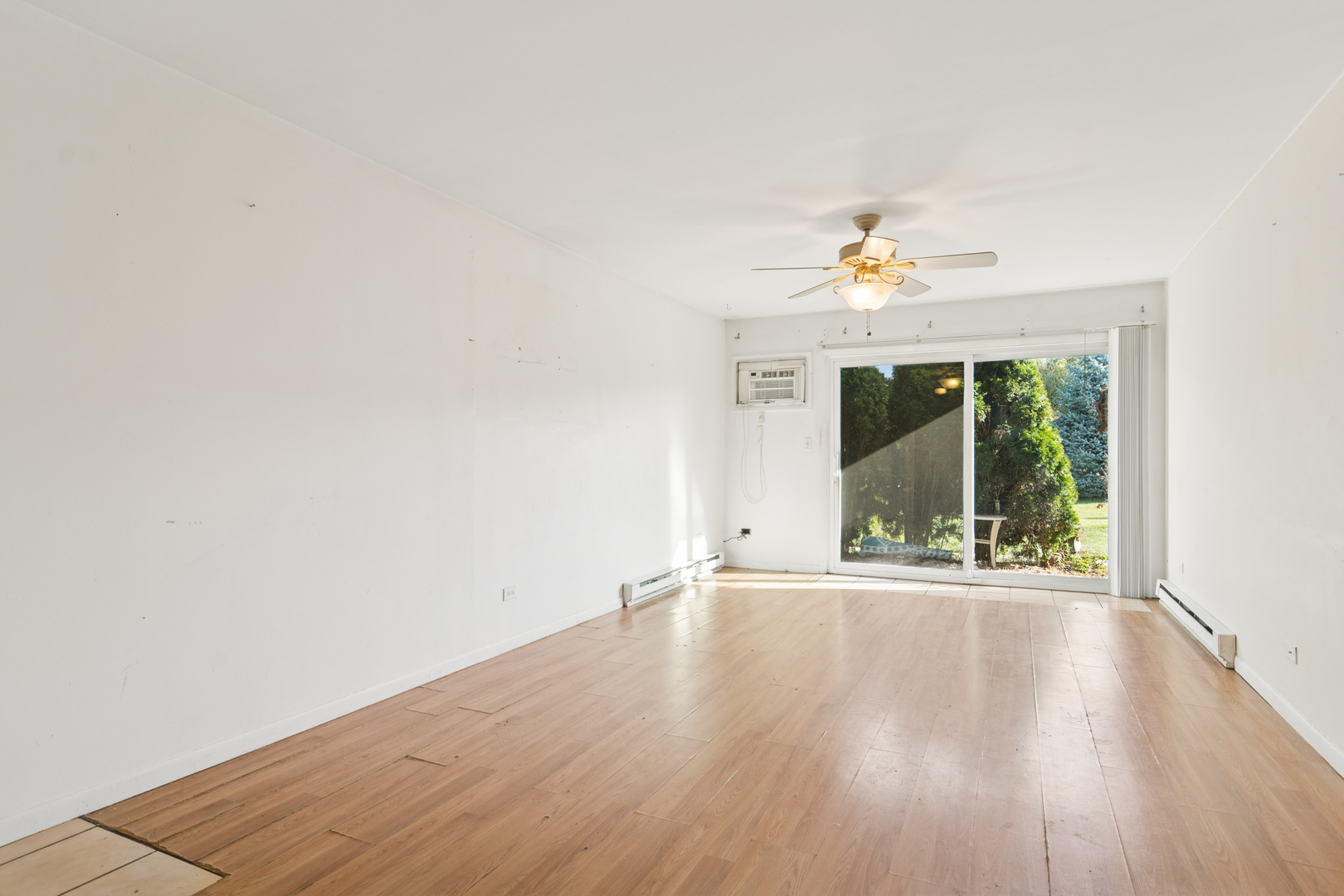 802 East Old Willow Road, Unit 113 Prospect Heights, IL 60070 - Photo 2 of 11 wooden floor in an empty room with a window
