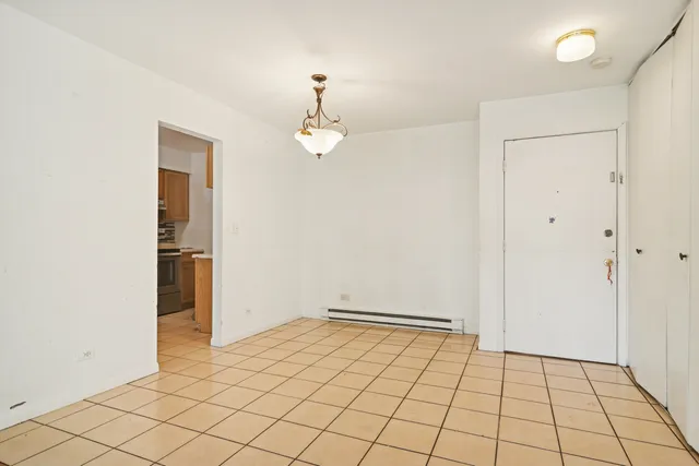 an empty room with wooden floor