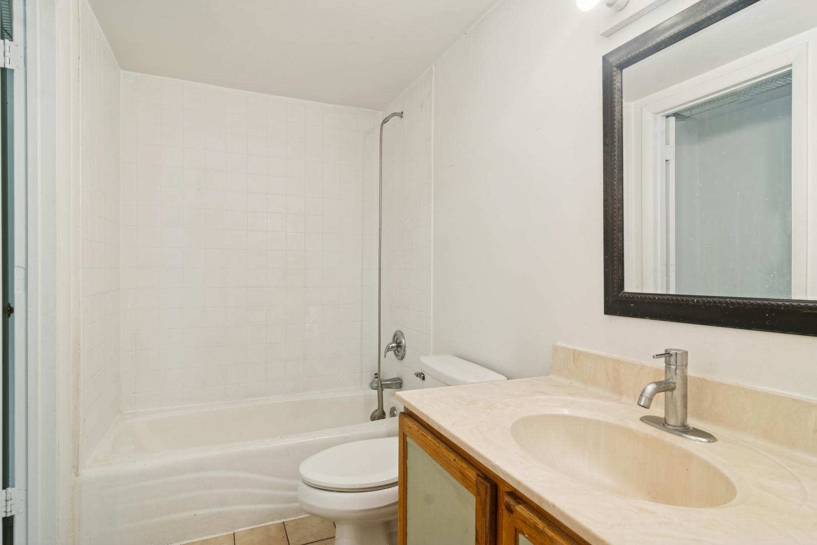 802 East Old Willow Road, Unit 113 Prospect Heights, IL 60070 - Photo 9 of 11 a bathroom with a sink toilet and shower