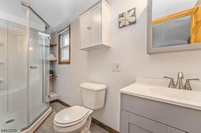 a bathroom with a toilet sink and shower
