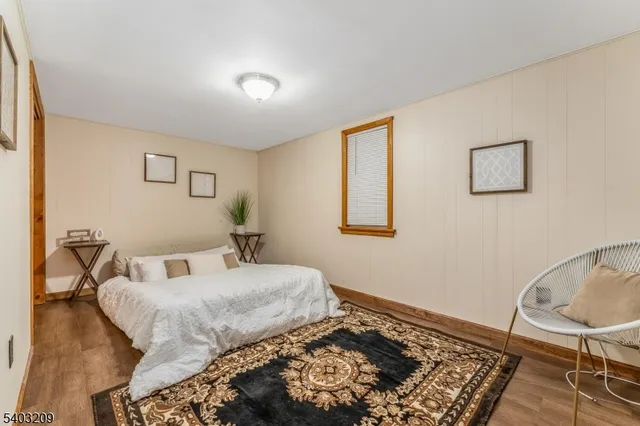 a bedroom with a bed and chair