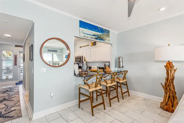 a view of a livingroom with furniture and a mirror