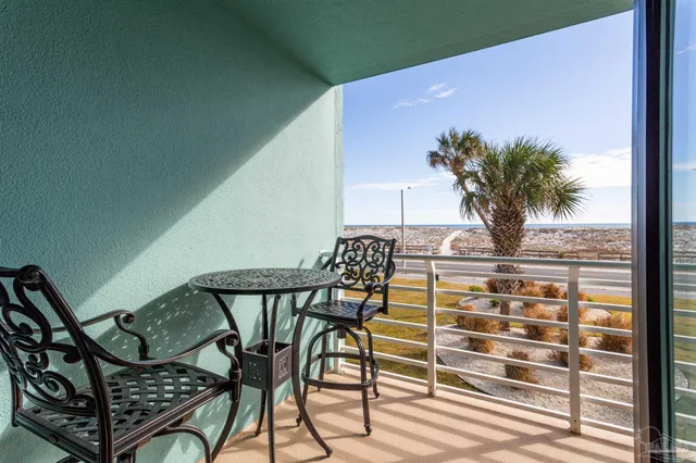 a view of balcony with furniture