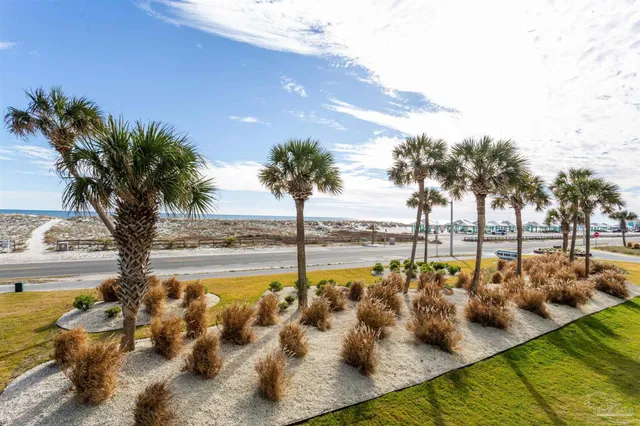 a view of a swimming pool with a table and chairs