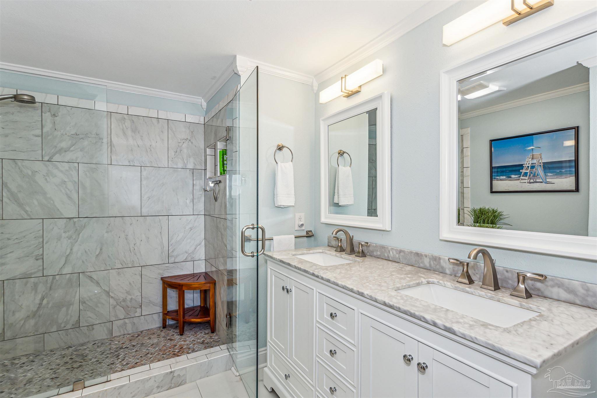 1390 Fort Pickens Road, Unit 116 Pensacola Beach, FL 32561 - Photo 25 of 37 a bathroom with a granite countertop sink and a mirror