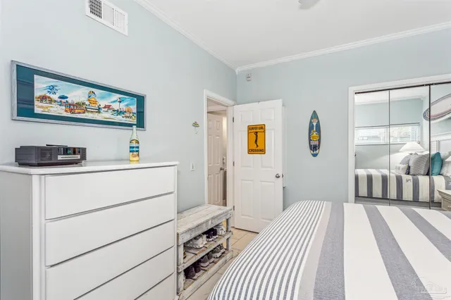 a bedroom with a bed and a couch