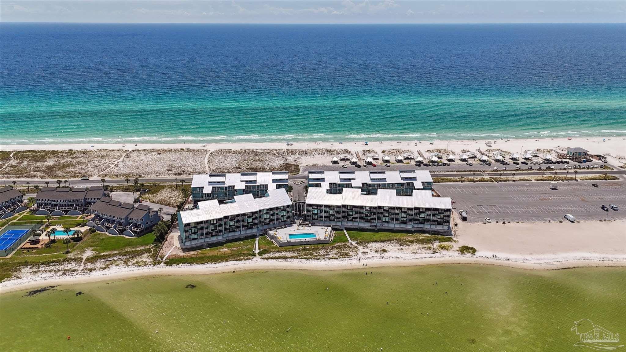 1390 Fort Pickens Road, Unit 116 Pensacola Beach, FL 32561 - Photo 31 of 37 a view of a lake with a big yard