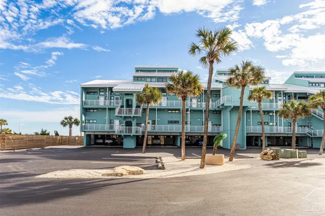 a view of a street with a building in the background