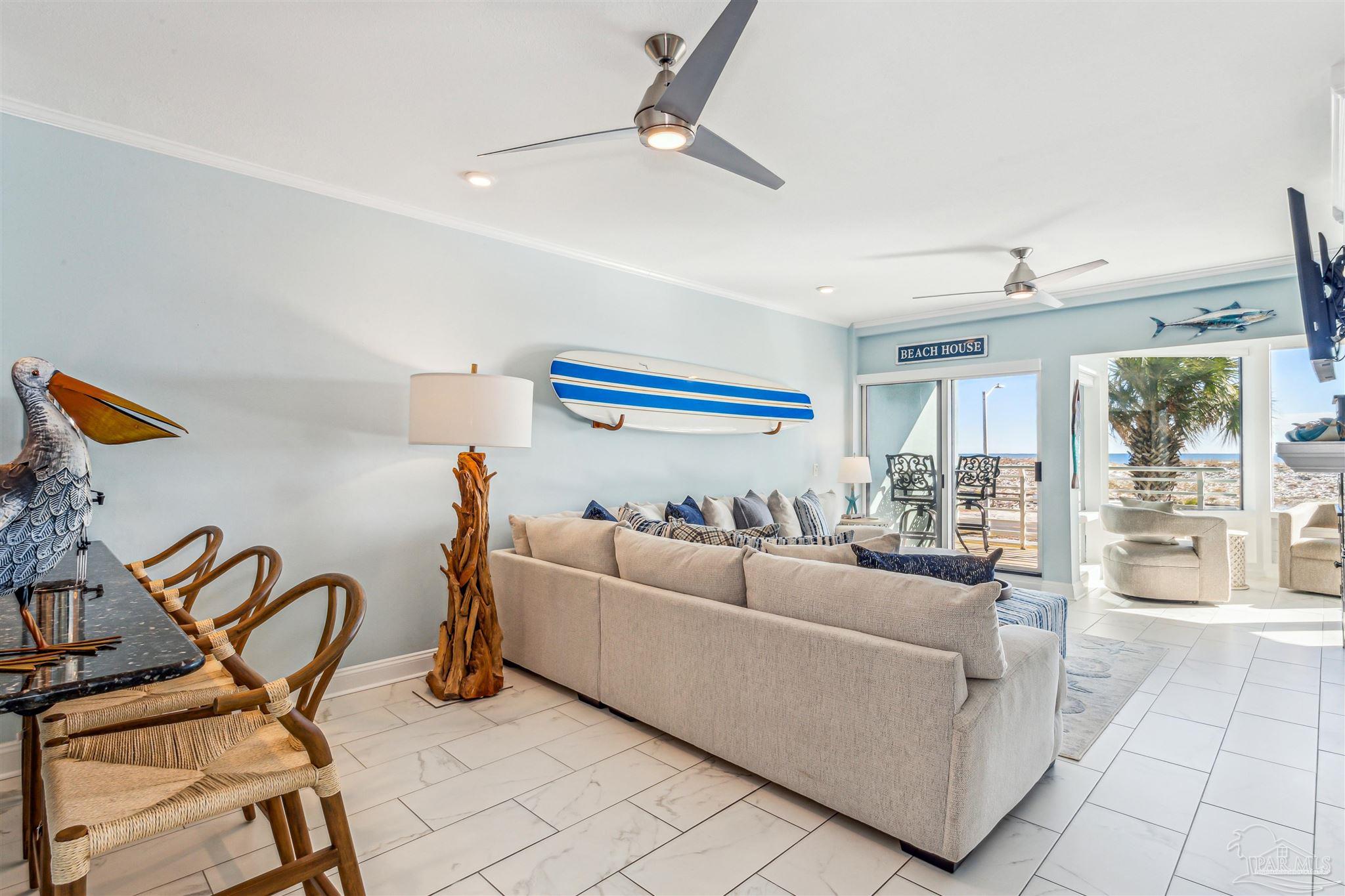 1390 Fort Pickens Road, Unit 116 Pensacola Beach, FL 32561 - Photo 6 of 37 a living room with furniture