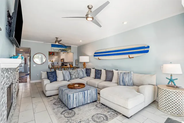a living room with furniture and a flat screen tv