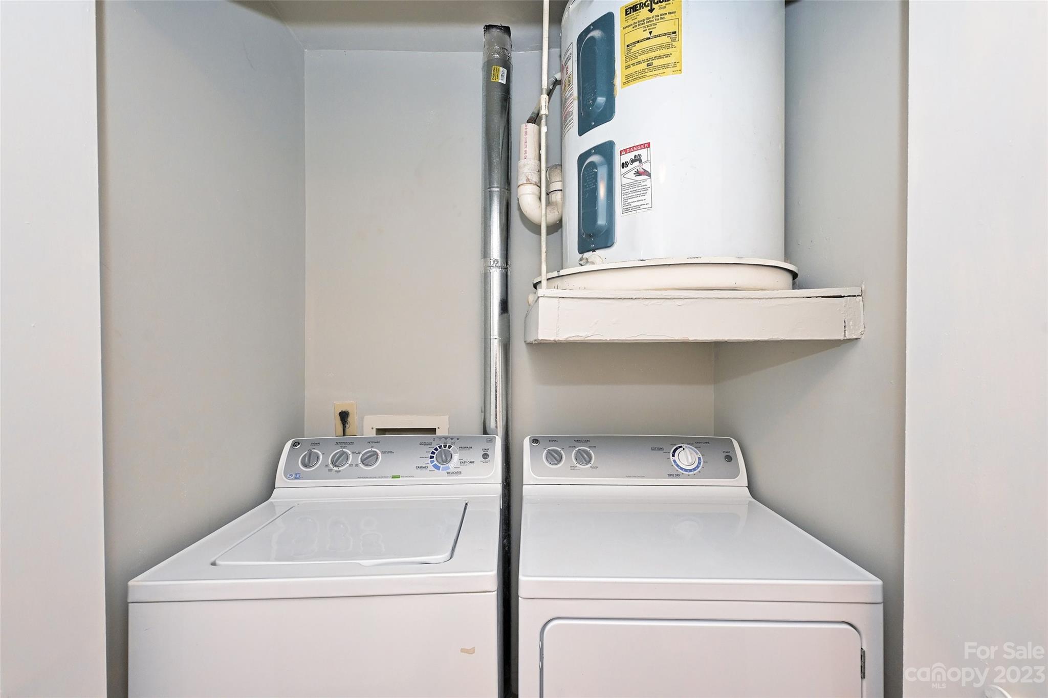 430 Queens Road, Unit 612 Charlotte, NC 28207 - Photo 16 of 22 a utility room with dryer and washer