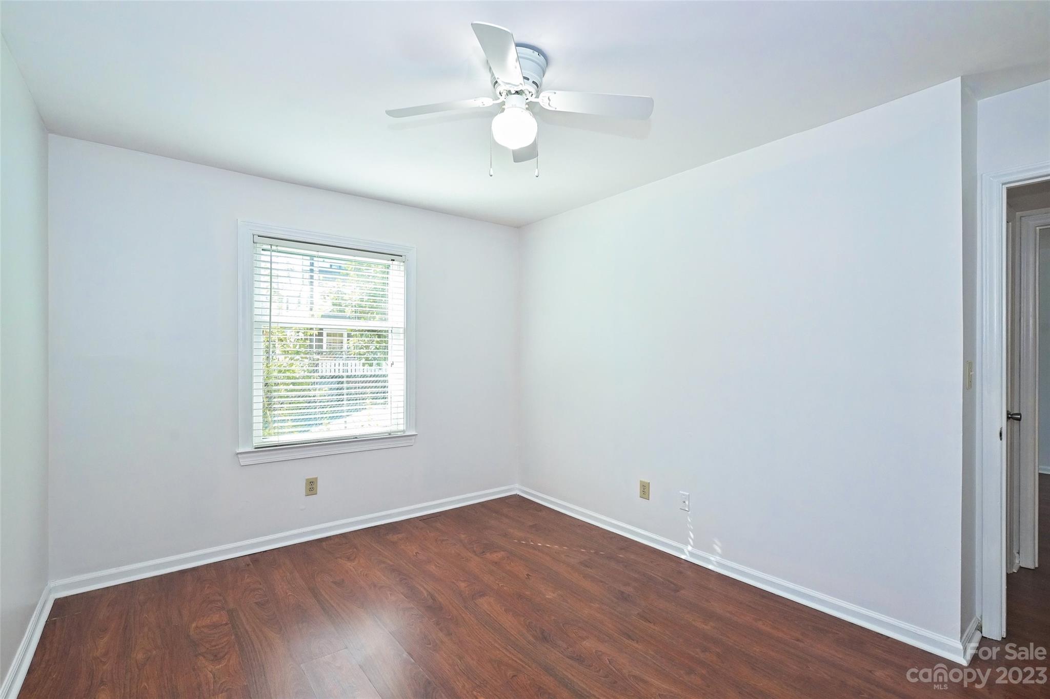 430 Queens Road, Unit 612 Charlotte, NC 28207 - Photo 21 of 22 an empty room with a window and a fan