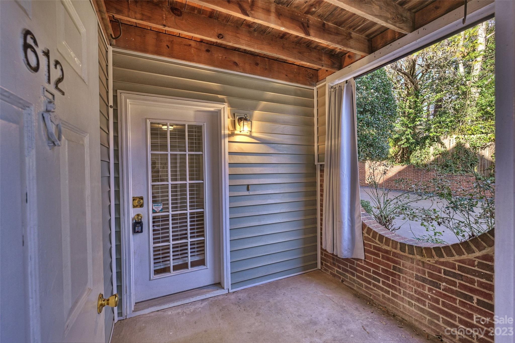 430 Queens Road, Unit 612 Charlotte, NC 28207 - Photo 3 of 22 a view of a door and wooden floor