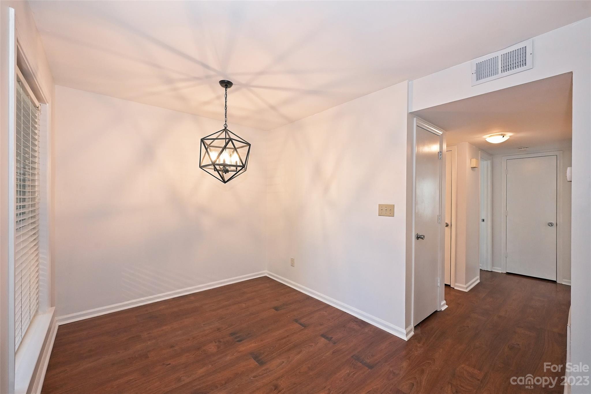 430 Queens Road, Unit 612 Charlotte, NC 28207 - Photo 8 of 22 a view of a room with wooden floor