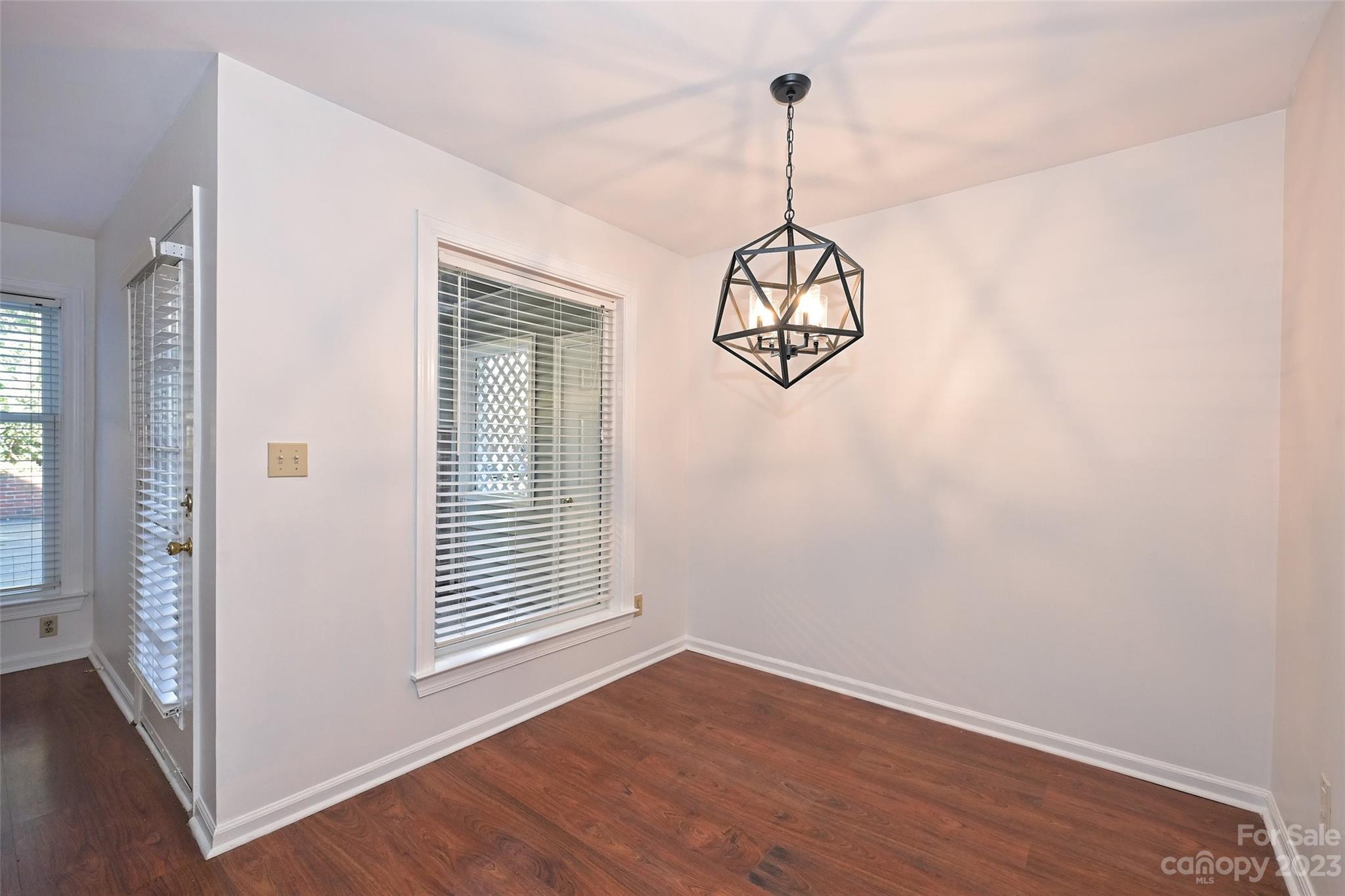 430 Queens Road, Unit 612 Charlotte, NC 28207 - Photo 9 of 22 a view of a room with wooden floor and windows