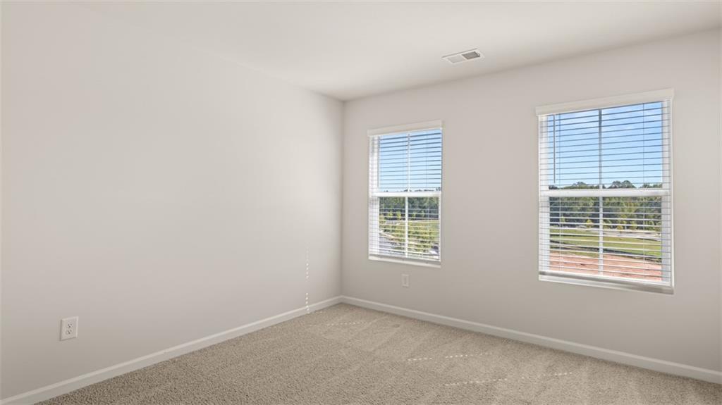 906 Stow Lane Monroe, GA 30655 - Photo 26 of 28 an empty room with a window