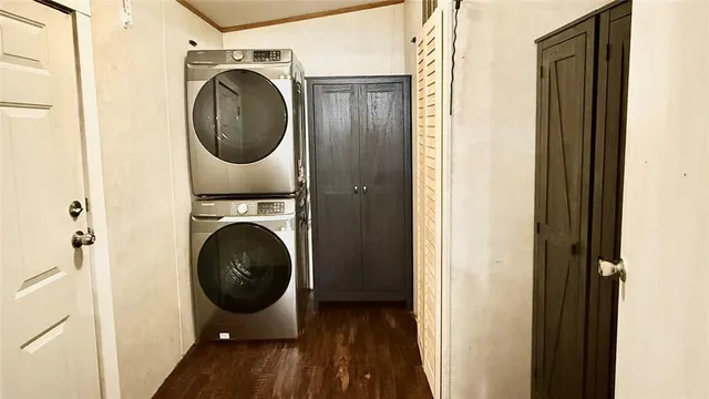 a view of a hallway with washer and dryer