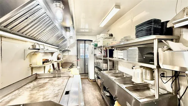 a view of a room with racks on the wall