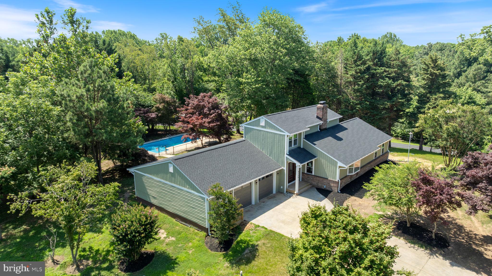 4735 Paul Hance Road Huntingtown, MD 20639 - Photo 3 of 64 aerial view of a house with a yard and trees