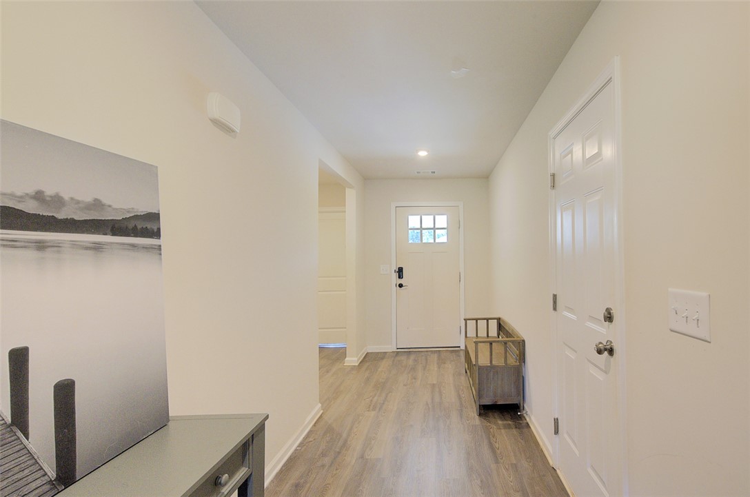 408 Chadwick Lane Walhalla, SC 29691 - Photo 4 of 44 A welcoming entryway features durable flooring, leading to a front door with elegant window panes.
