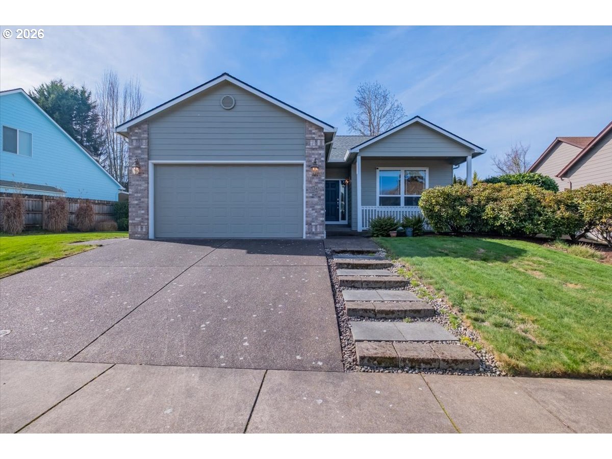 2066 Northwest Violet Avenue Albany, OR 97321 - Photo 1 of 48 a front view of a house with a yard and garage