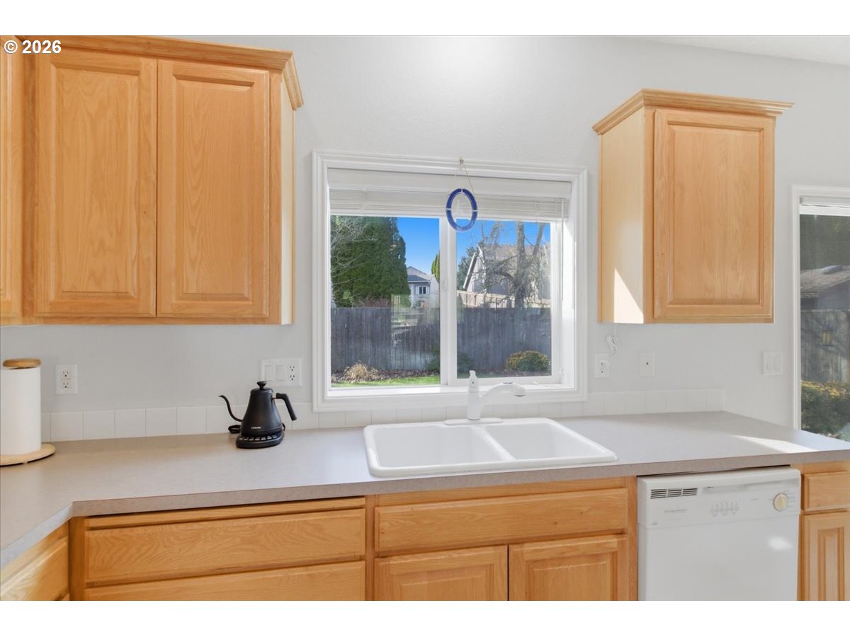 2066 Northwest Violet Avenue Albany, OR 97321 - Photo 19 of 48 a bathroom with a sink and a window