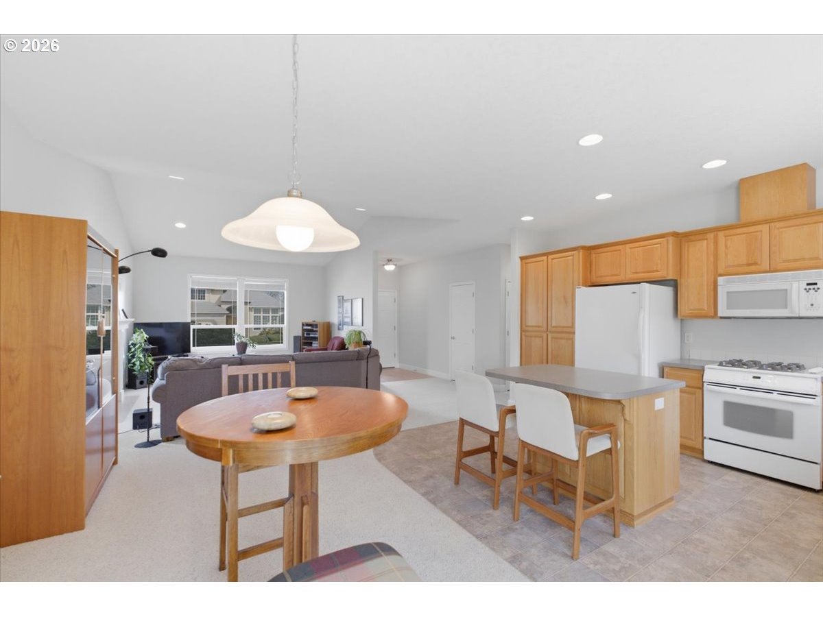 2066 Northwest Violet Avenue Albany, OR 97321 - Photo 22 of 48 a living room with furniture a table and chairs