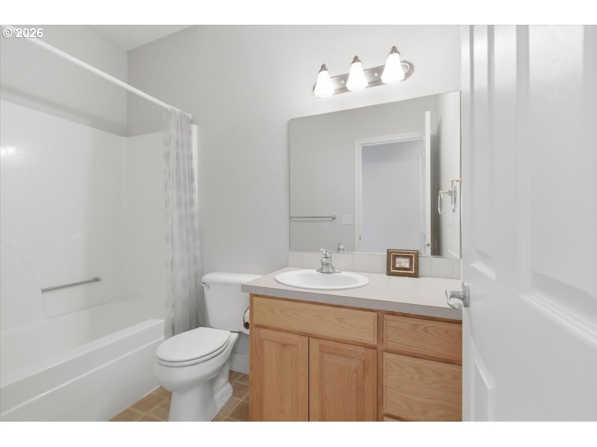 2066 Northwest Violet Avenue Albany, OR 97321 - Photo 29 of 48 a bathroom with a sink vanity mirror and toilet