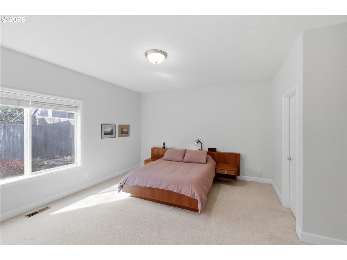2066 Northwest Violet Avenue Albany, OR 97321 - Photo 32 of 48 a bedroom with a bed and window