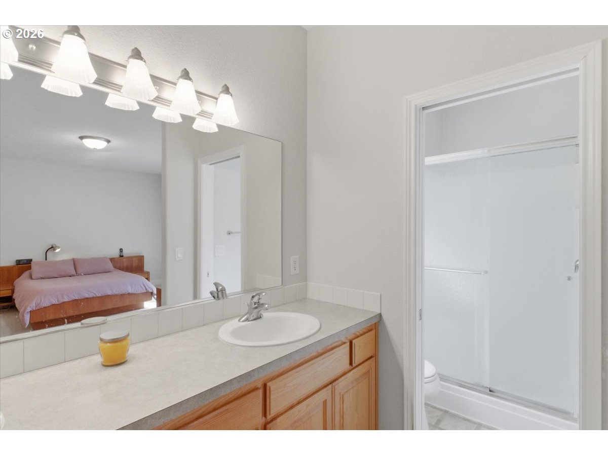 2066 Northwest Violet Avenue Albany, OR 97321 - Photo 35 of 48 a bathroom with a sink vanity and a mirror