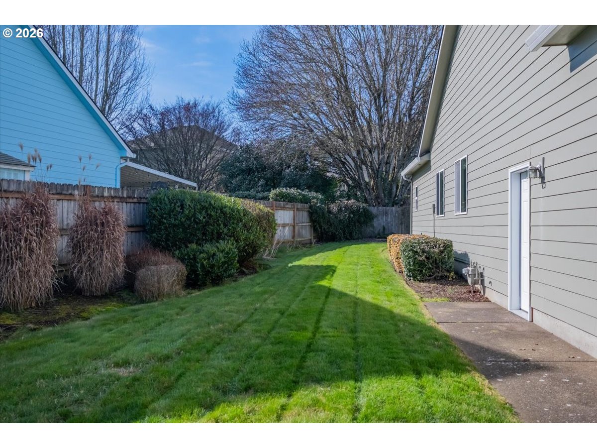 2066 Northwest Violet Avenue Albany, OR 97321 - Photo 47 of 48 a view of a backyard with potted plants and large tree