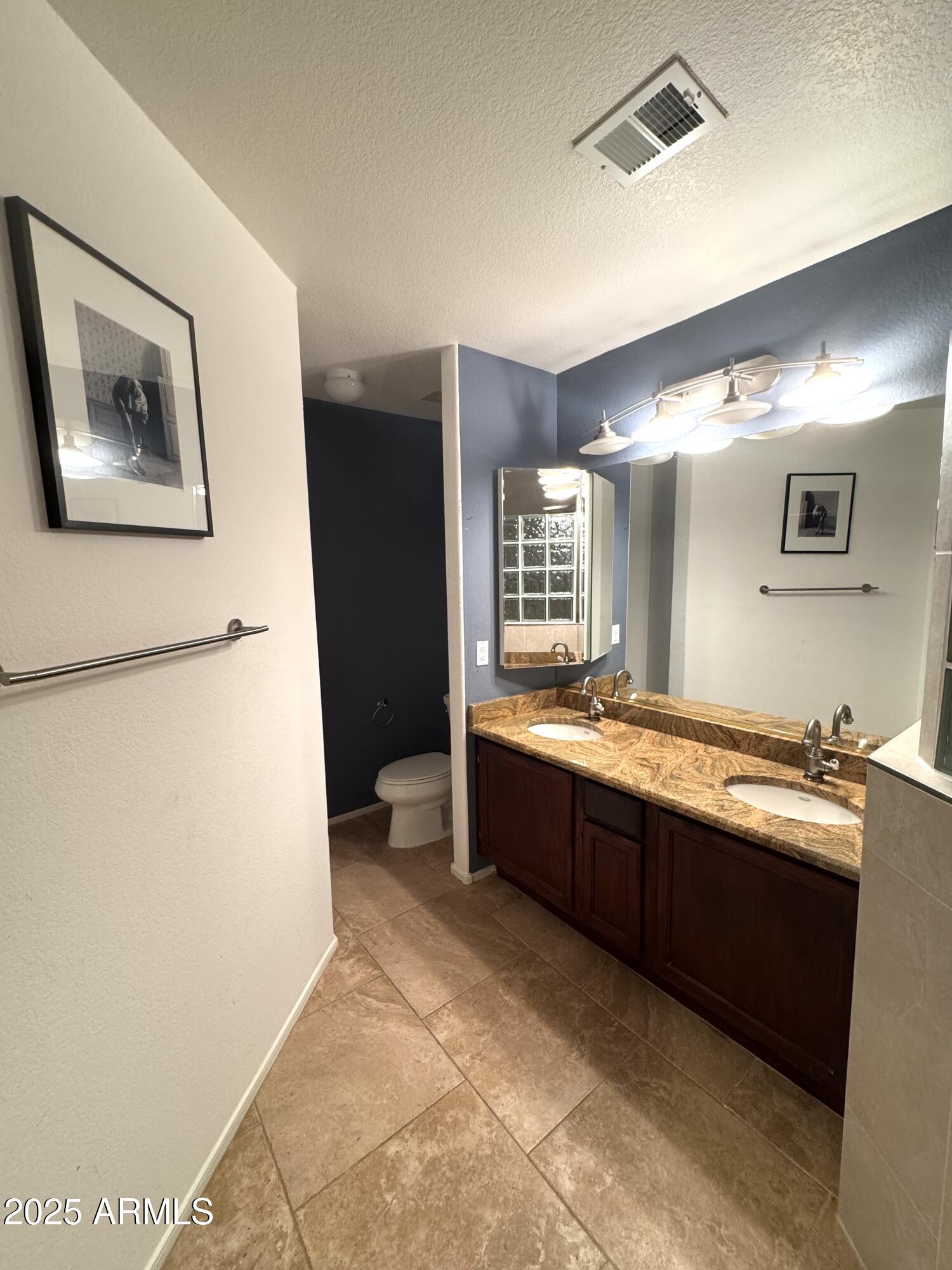 8833 South 51st Street, Unit 3 Phoenix, AZ 85044 - Photo 11 of 26 a large bathroom with a tub and sink