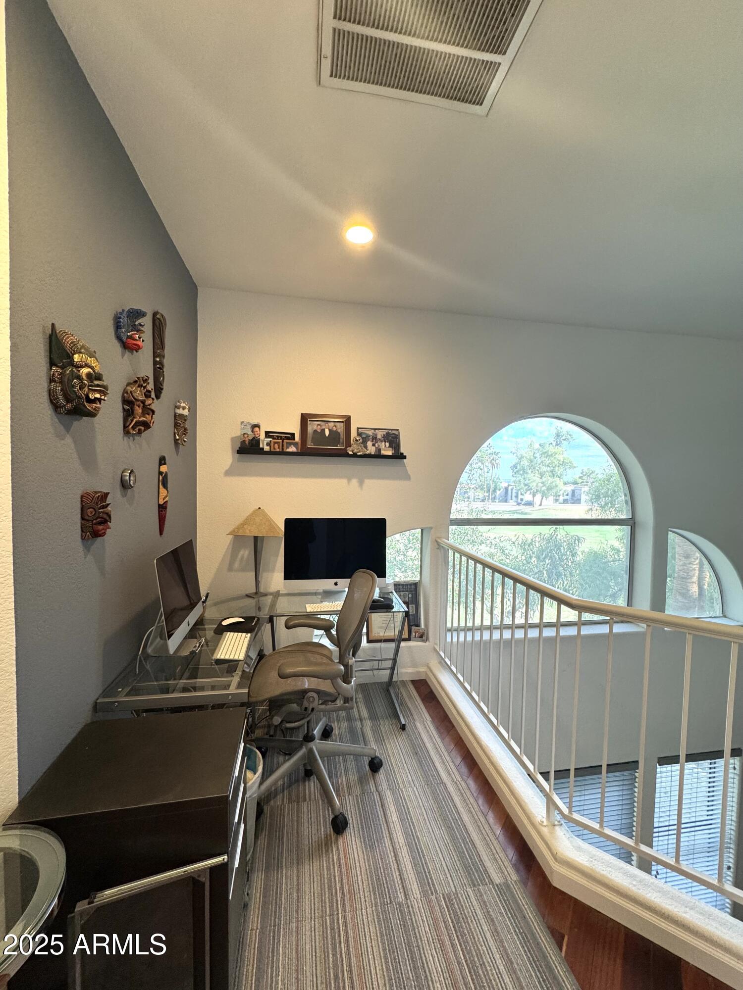8833 South 51st Street, Unit 3 Phoenix, AZ 85044 - Photo 15 of 26 a view of a chairs and table in a balcony
