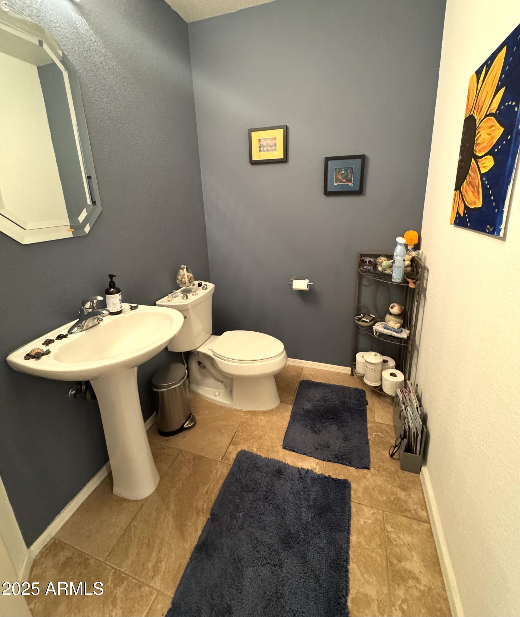 8833 South 51st Street, Unit 3 Phoenix, AZ 85044 - Photo 17 of 26 a bathroom with a sink and a mirror