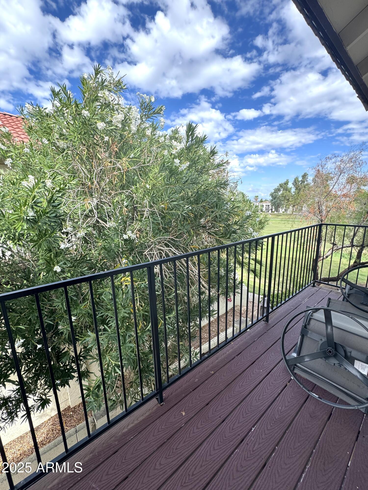 8833 South 51st Street, Unit 3 Phoenix, AZ 85044 - Photo 18 of 26 a view of balcony with wooden floor and fence