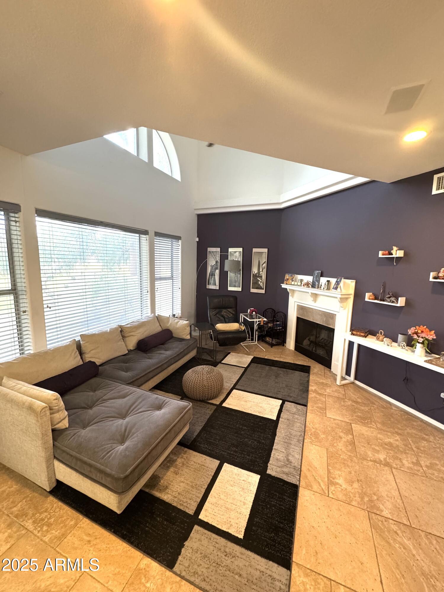 8833 South 51st Street, Unit 3 Phoenix, AZ 85044 - Photo 2 of 26 a living room with furniture and a table