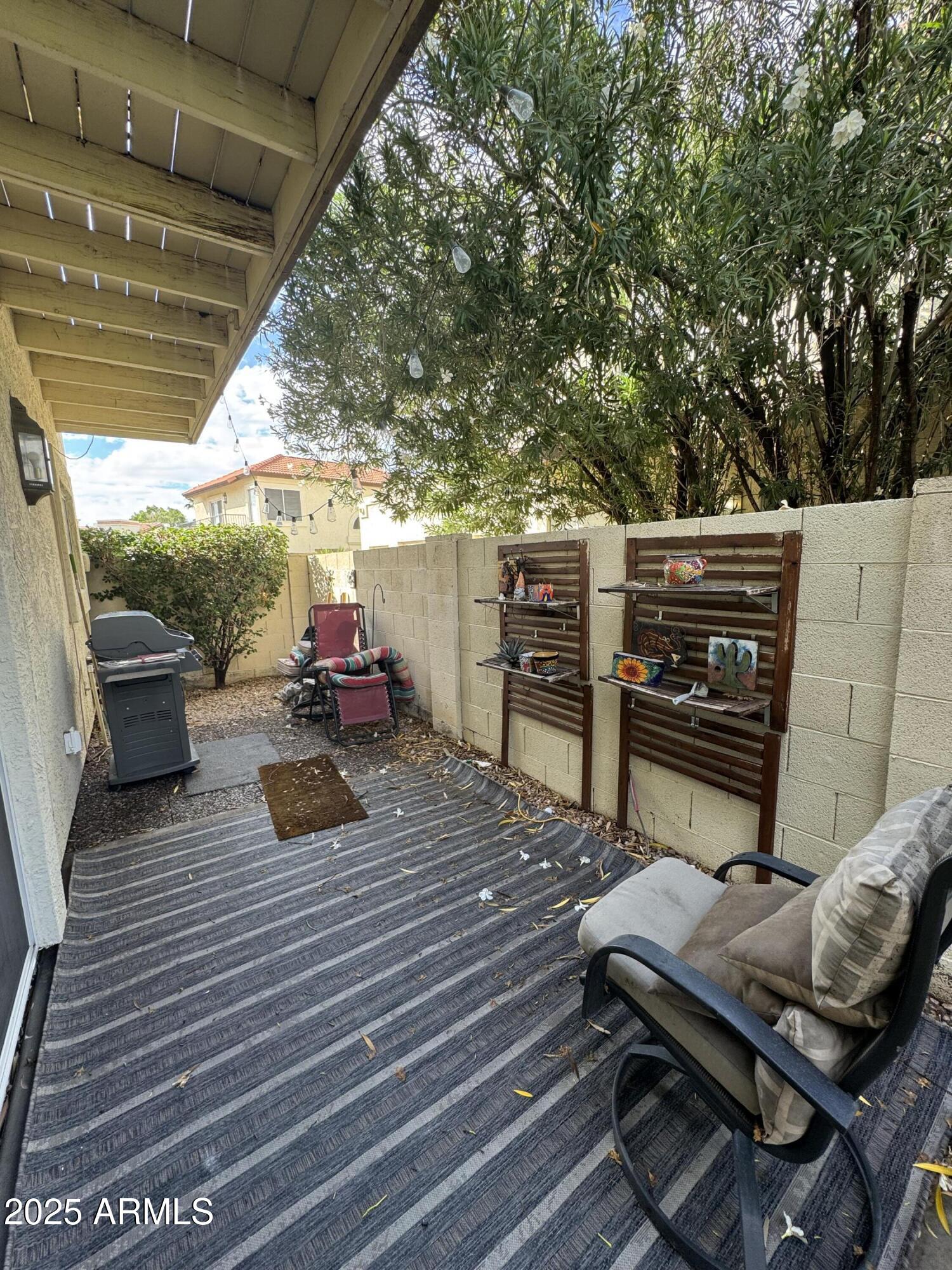 8833 South 51st Street, Unit 3 Phoenix, AZ 85044 - Photo 21 of 26 a view of a deck with wooden floor and outdoor seating