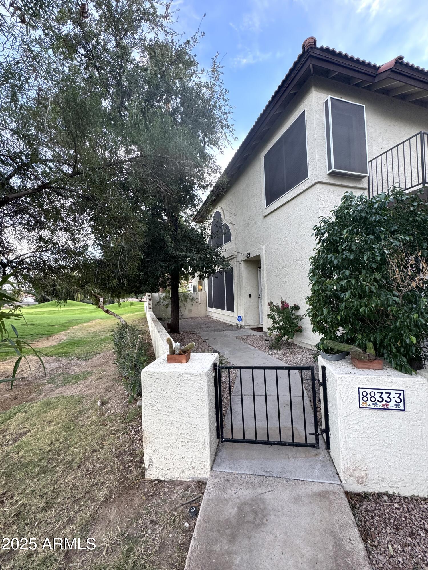 8833 South 51st Street, Unit 3 Phoenix, AZ 85044 - Photo 22 of 26 a view of a house with a yard
