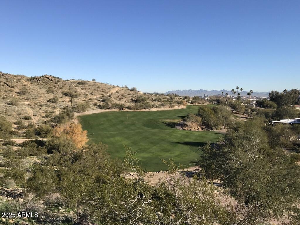8833 South 51st Street, Unit 3 Phoenix, AZ 85044 - Photo 23 of 26 a view of a lake with mountains in the background