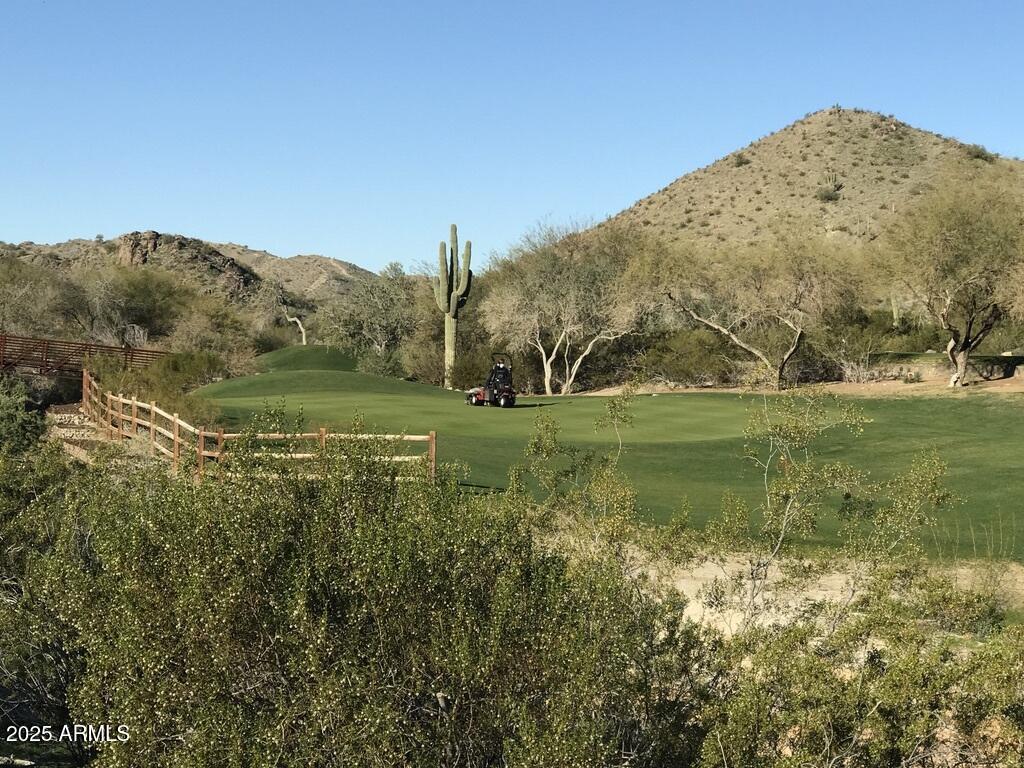 8833 South 51st Street, Unit 3 Phoenix, AZ 85044 - Photo 24 of 26 a view of a water with a building in the background