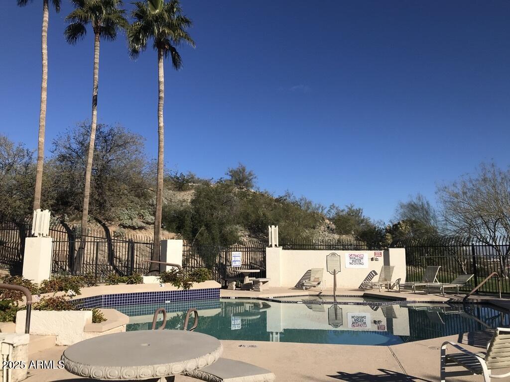 8833 South 51st Street, Unit 3 Phoenix, AZ 85044 - Photo 26 of 26 a view of a patio with swimming pool
