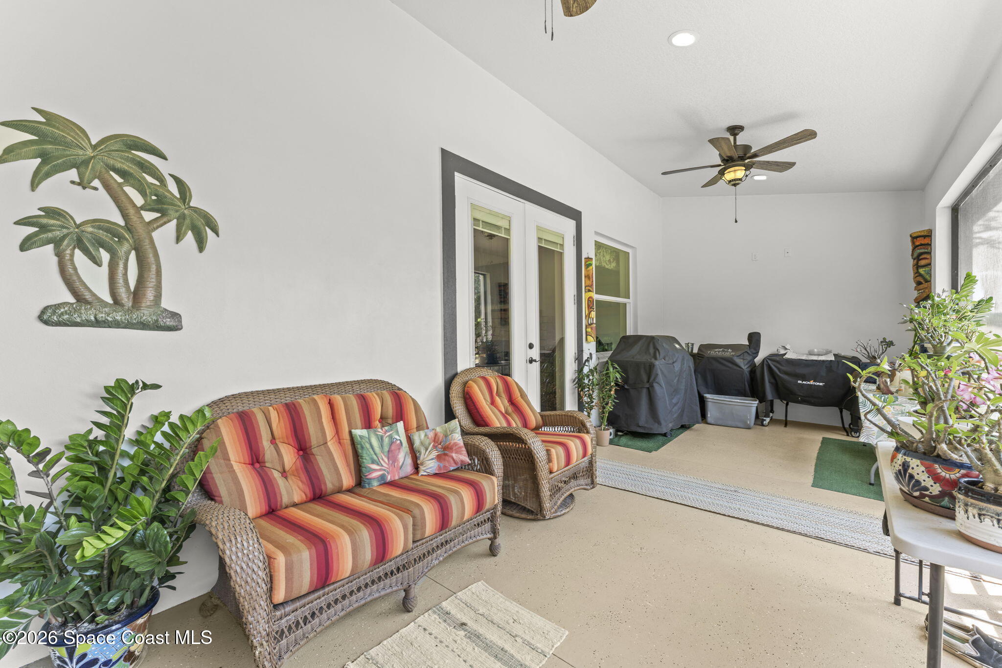 1740 Ford Road Mims, FL 32754 - Photo 36 of 43 a living room with furniture ceiling fan and a rug