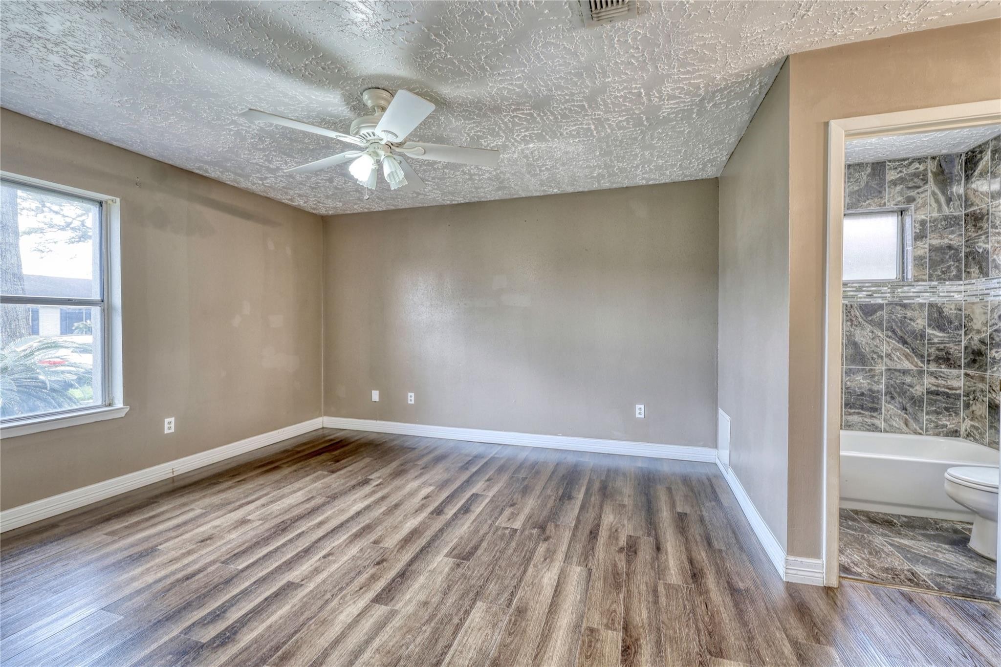 13331 Boyer Lane Houston, TX 77015 - Photo 14 of 21 wooden floor in an empty room with a window