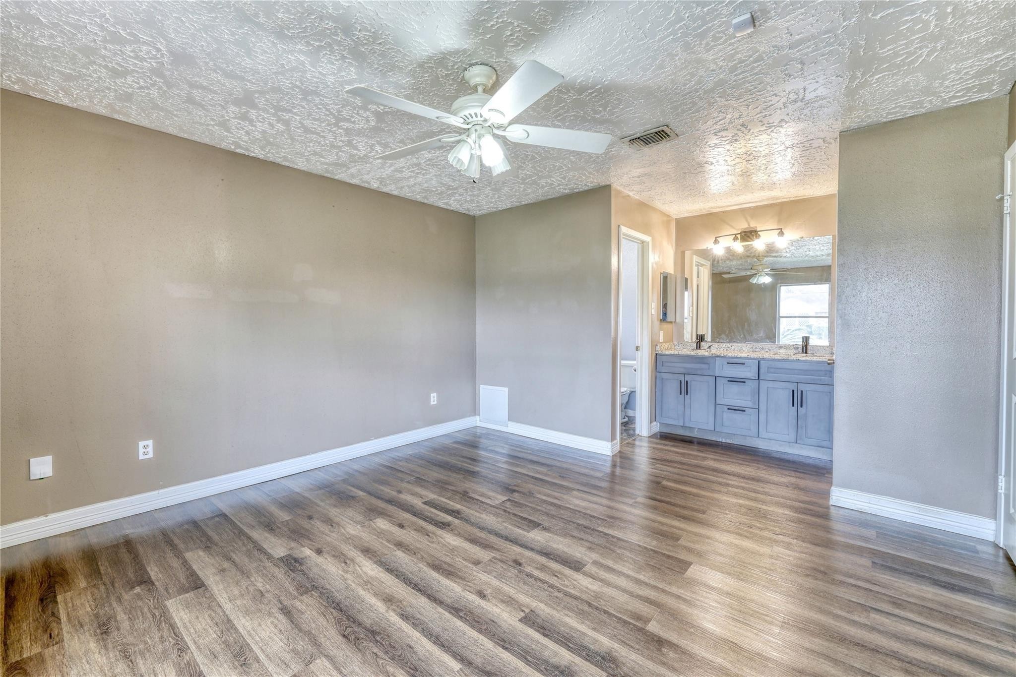 13331 Boyer Lane Houston, TX 77015 - Photo 16 of 21 wooden floor in an empty room with a window