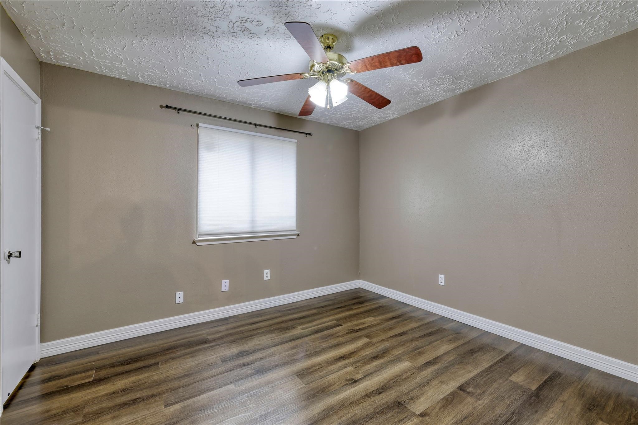 13331 Boyer Lane Houston, TX 77015 - Photo 18 of 21 wooden floor in an empty room with a window