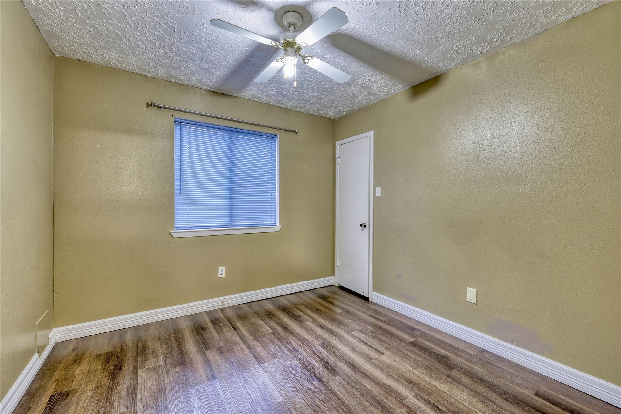 13331 Boyer Lane Houston, TX 77015 - Photo 19 of 21 a view of a room with wooden floor and a ceiling fan