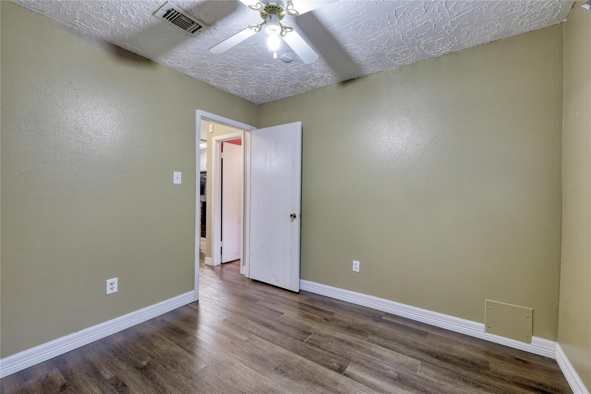 13331 Boyer Lane Houston, TX 77015 - Photo 20 of 21 an empty room with wooden floor and windows