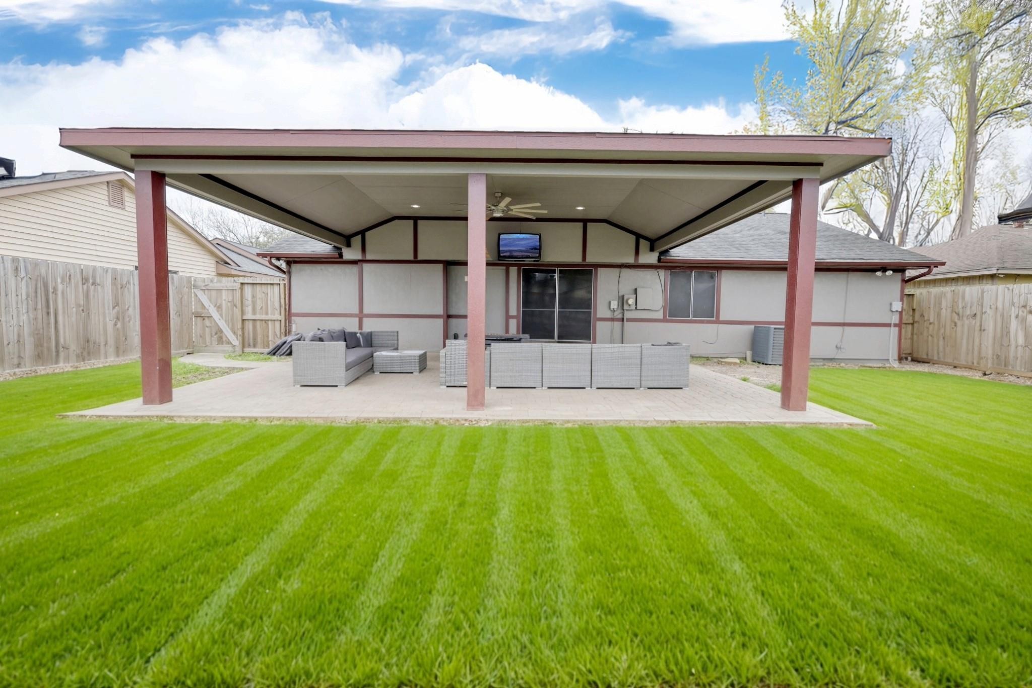 13331 Boyer Lane Houston, TX 77015 - Photo 2 of 21 a view of a patio with table and chairs with wooden floor and fence