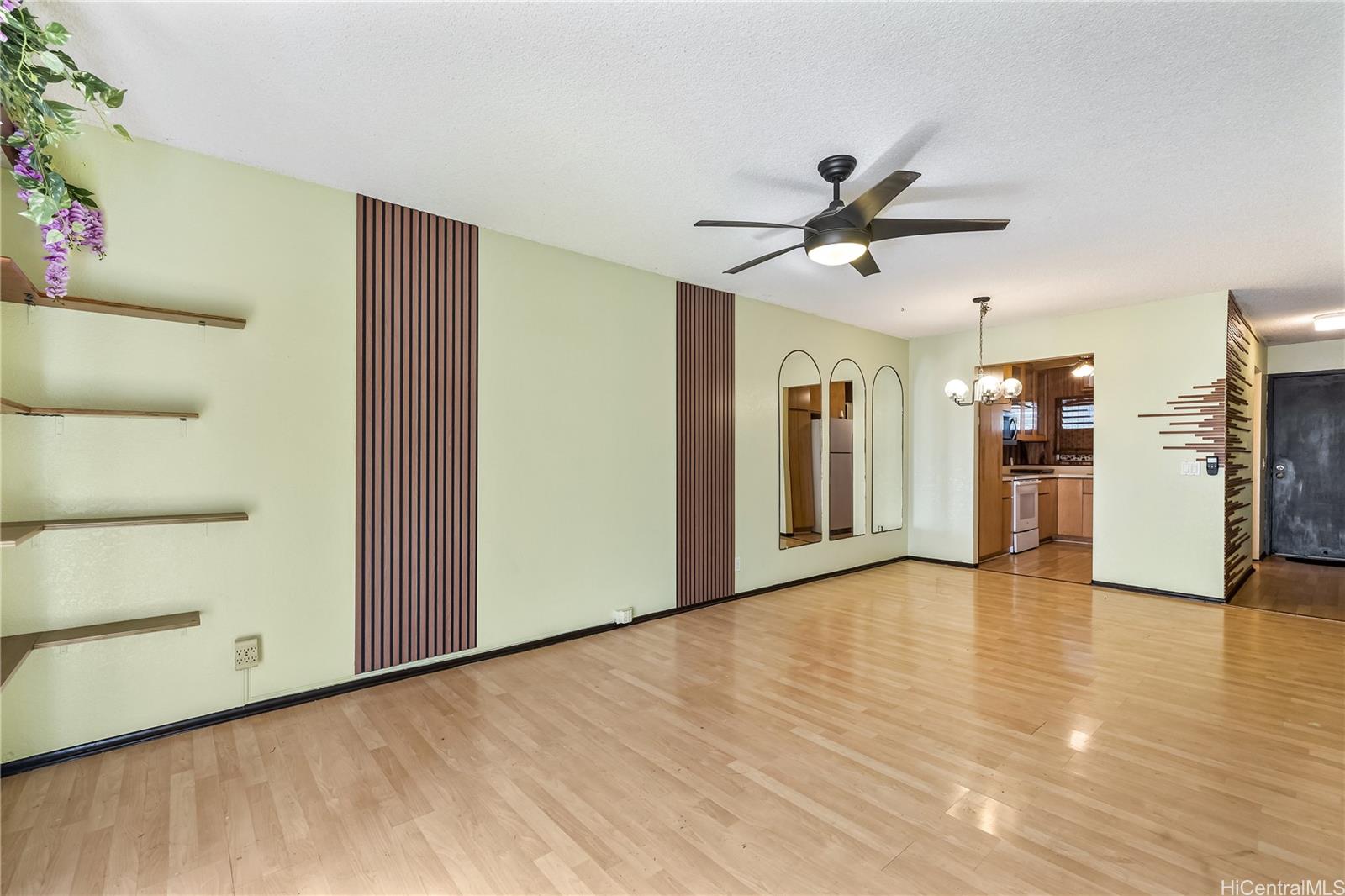 96-214 Waiawa Road, Unit 85 Pearl City, HI 96782 - Photo 2 of 10 a view of a kitchen with a sink and a refrigerator